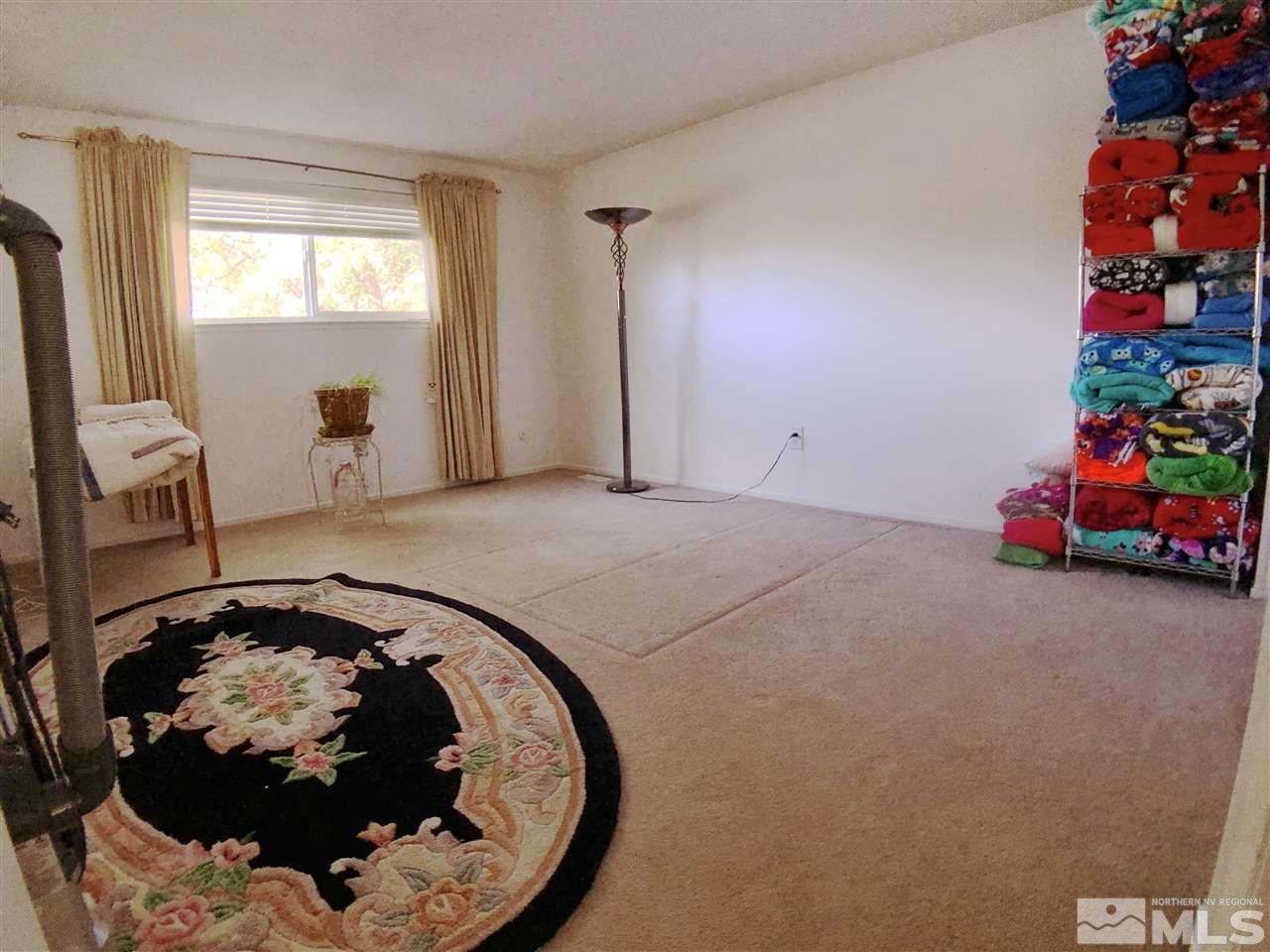 4210 Billy Drive Reno, NV 89502 - Photo 11 of 31 a bed room with a bed and a fireplace