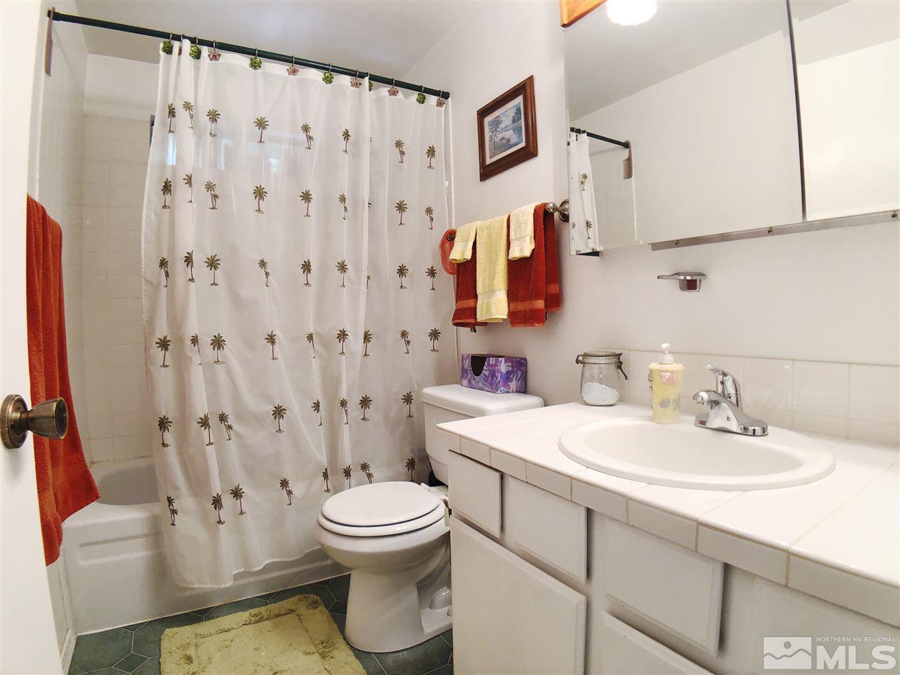 4210 Billy Drive Reno, NV 89502 - Photo 13 of 31 a bathroom with a sink toilet and shower