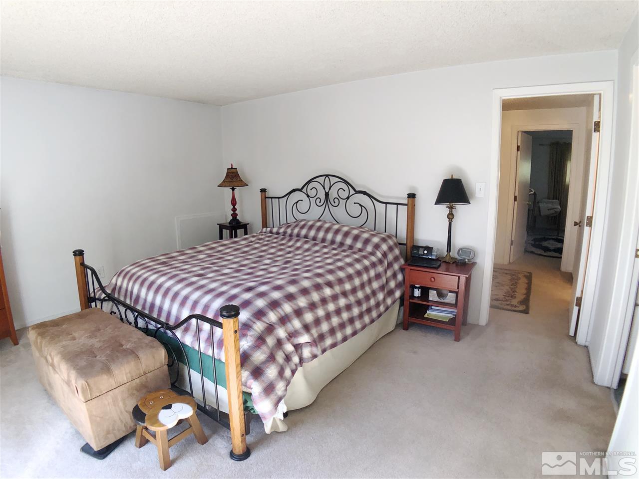 4210 Billy Drive Reno, NV 89502 - Photo 15 of 31 a bedroom with a bed and a lamp with the table