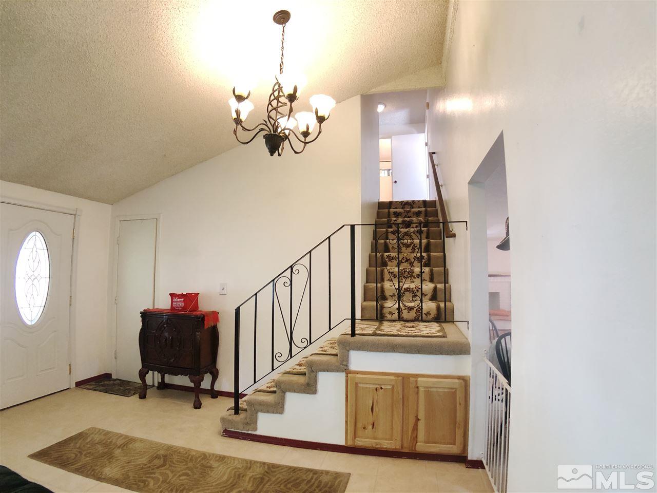 4210 Billy Drive Reno, NV 89502 - Photo 20 of 31 a view of a room with gym equipment and a mirror