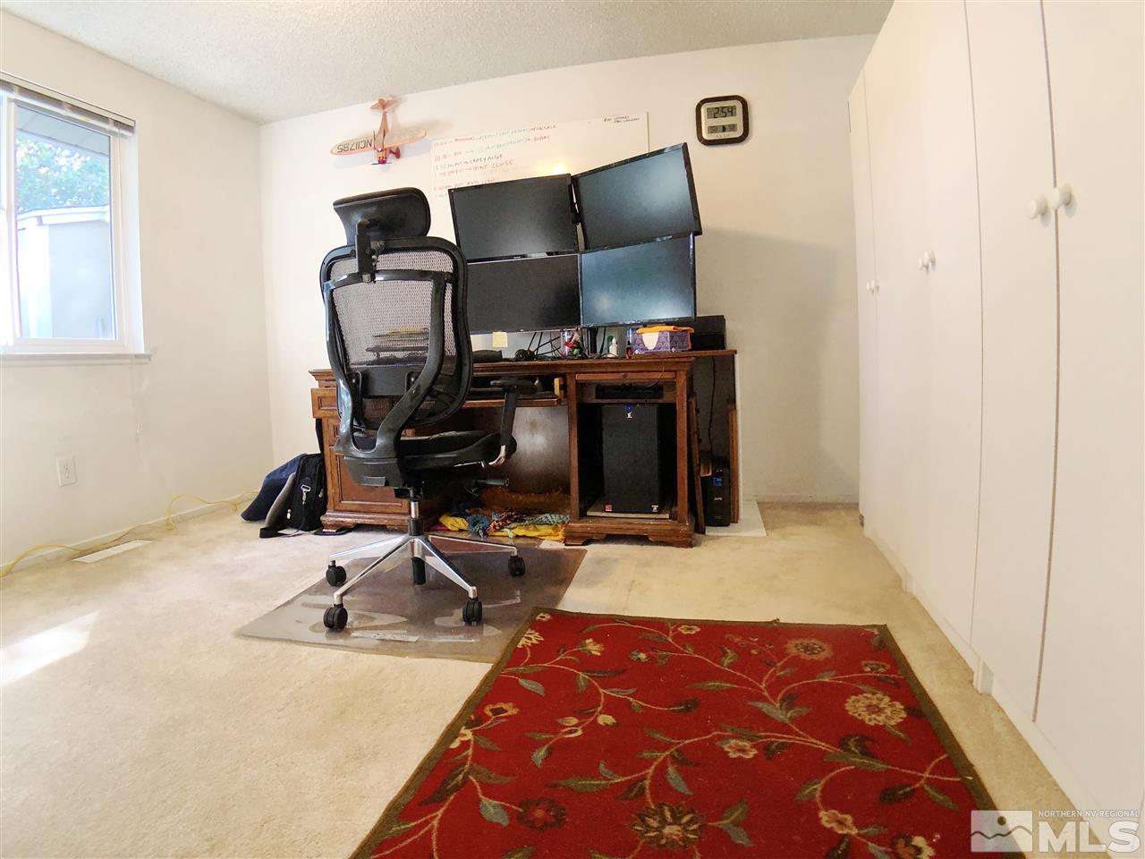 4210 Billy Drive Reno, NV 89502 - Photo 22 of 31 a room with gym equipment and wooden floor