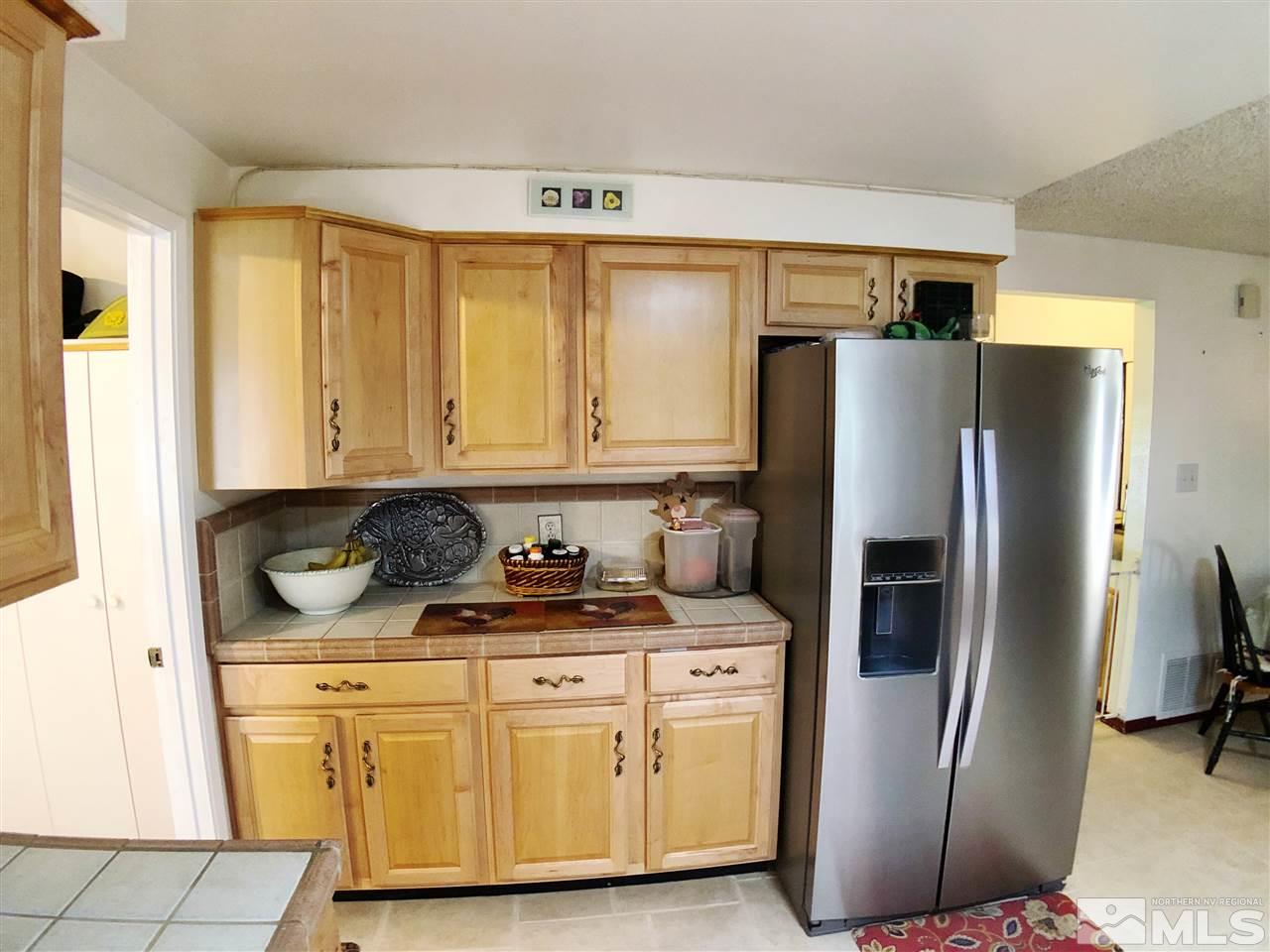 4210 Billy Drive Reno, NV 89502 - Photo 26 of 31 a kitchen with stainless steel appliances granite countertop a refrigerator and a stove