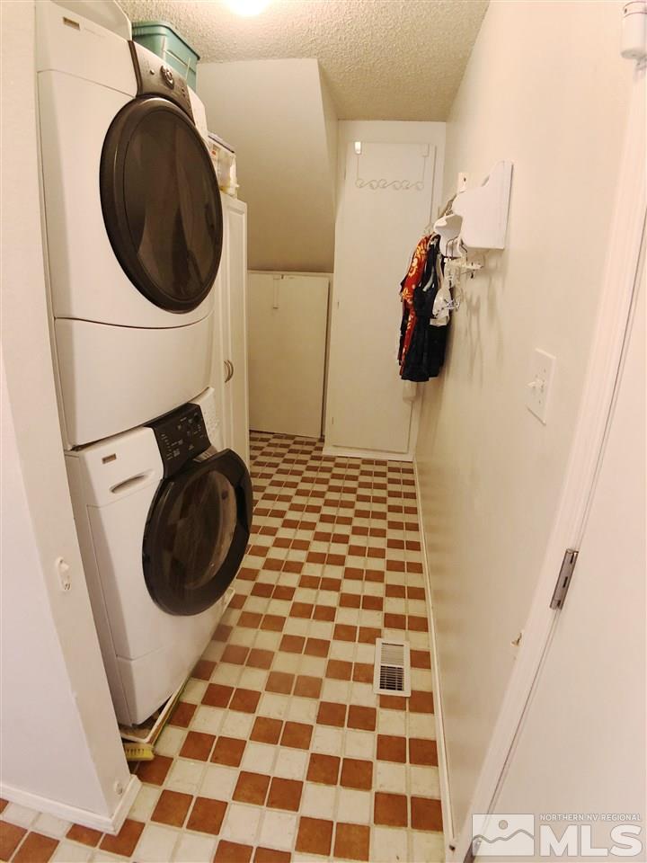4210 Billy Drive Reno, NV 89502 - Photo 29 of 31 a bathroom with a bathtub and a washing machine