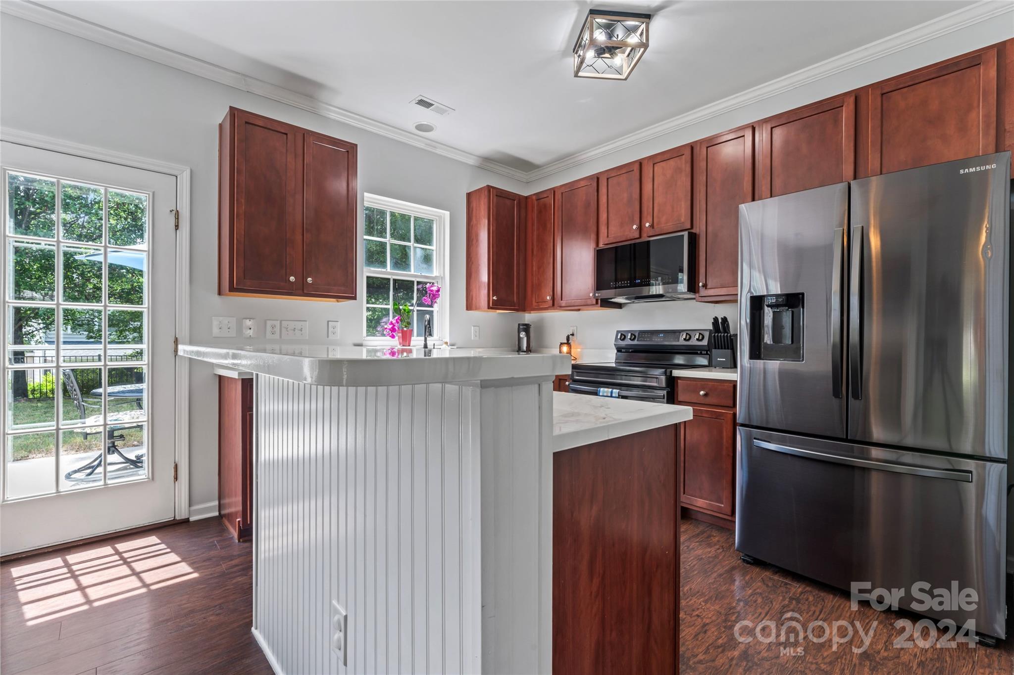 3144 Tanzanite Circle Fort Mill, SC 29708 - Photo 12 of 38 a kitchen with granite countertop stainless steel appliances a refrigerator microwave and stove top oven