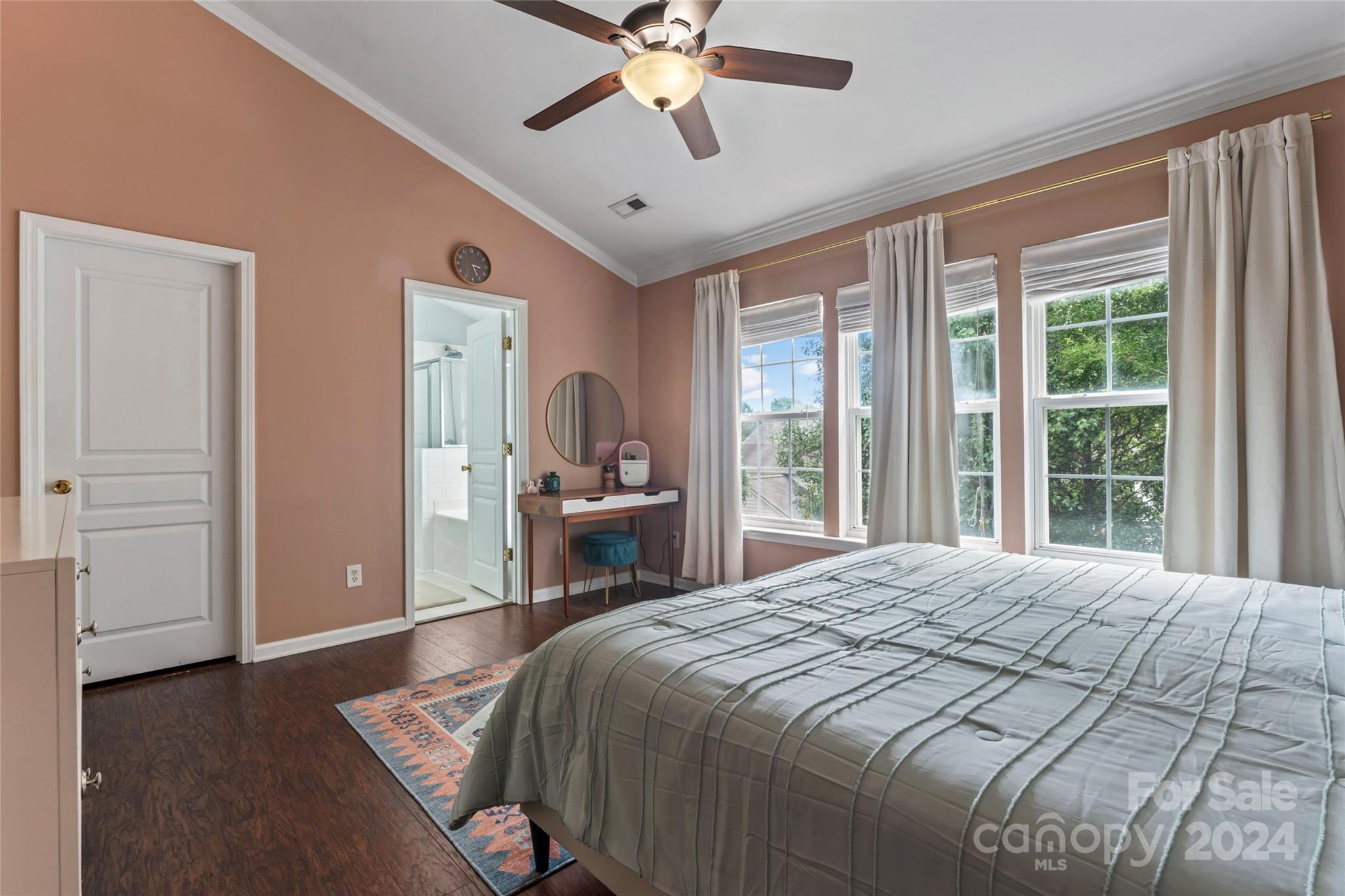 3144 Tanzanite Circle Fort Mill, SC 29708 - Photo 17 of 38 a spacious bedroom with a large bed and a chandelier
