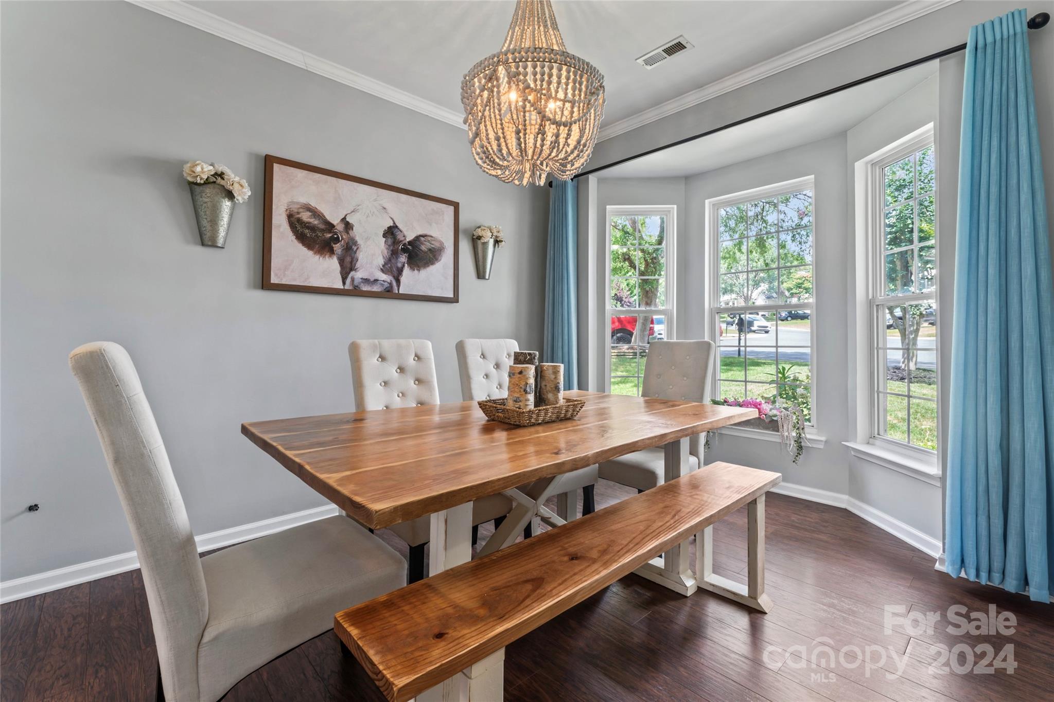 3144 Tanzanite Circle Fort Mill, SC 29708 - Photo 5 of 38 a view of a dining room with furniture wooden floor and a chandelier