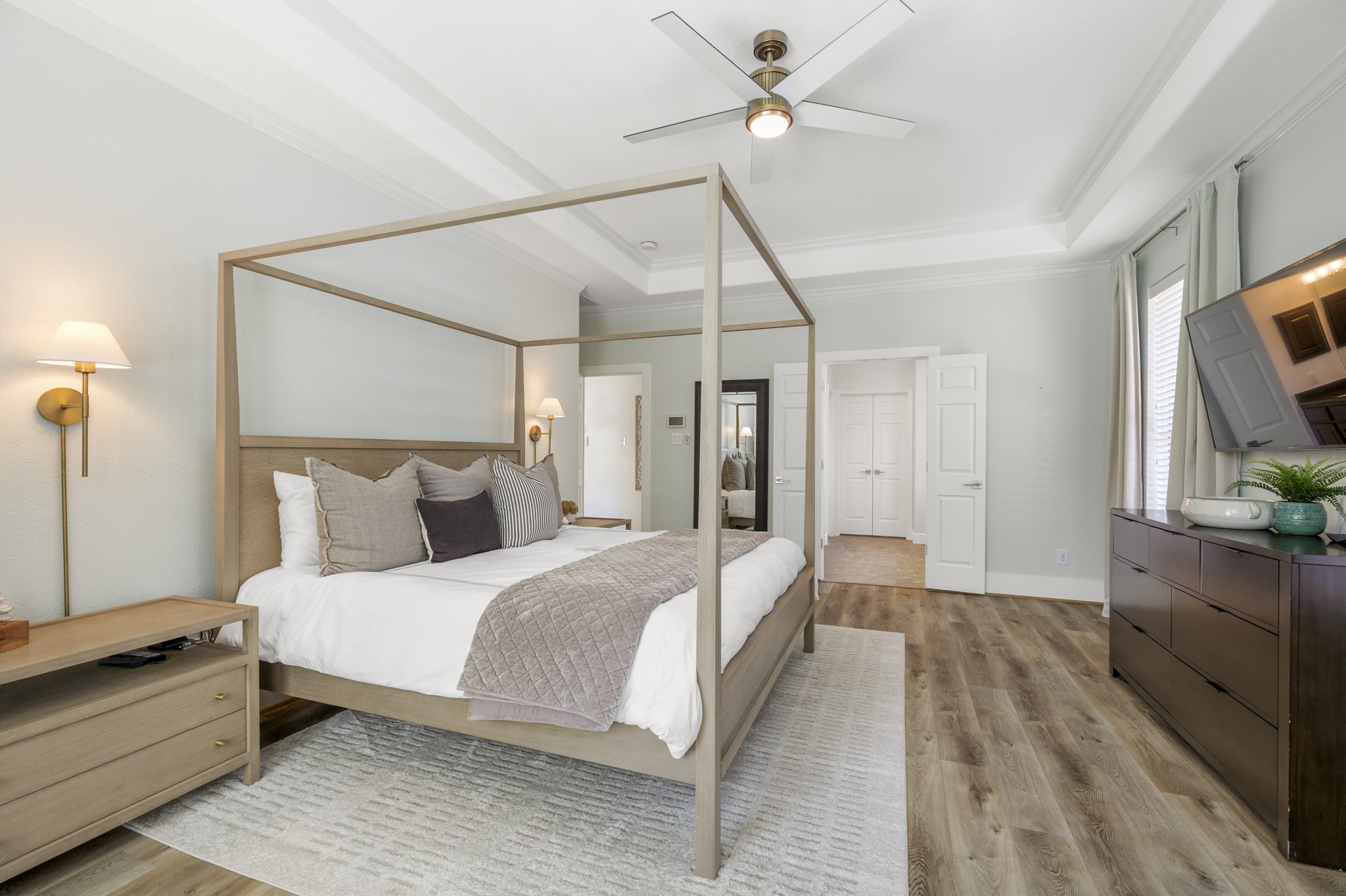 26 Winhall Place The Woodlands, TX 77354 - Photo 24 of 49 a bedroom with a bed and a flat screen tv