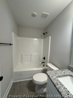 390 Summerhill Road Fayetteville, NC 28303 - Photo 17 of 27 a bathroom with a granite countertop sink a toilet and shower