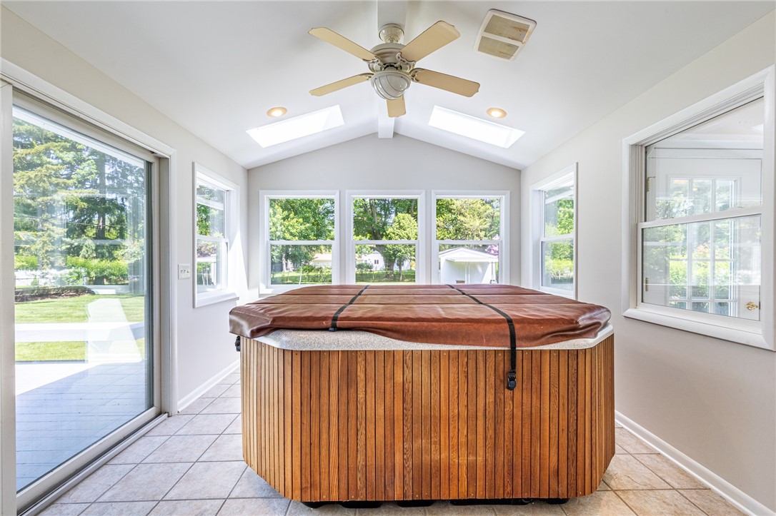 274 Parkview Drive Rochester, NY 14625 - Photo 11 of 41 Sun room with hot tub. Left door to deck.