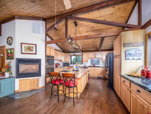 a open kitchen with a table and chairs