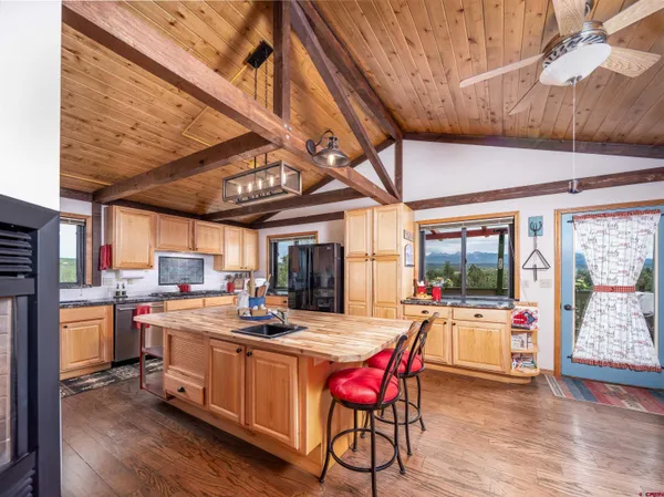 a view of a kitchen with a sink and dishwasher