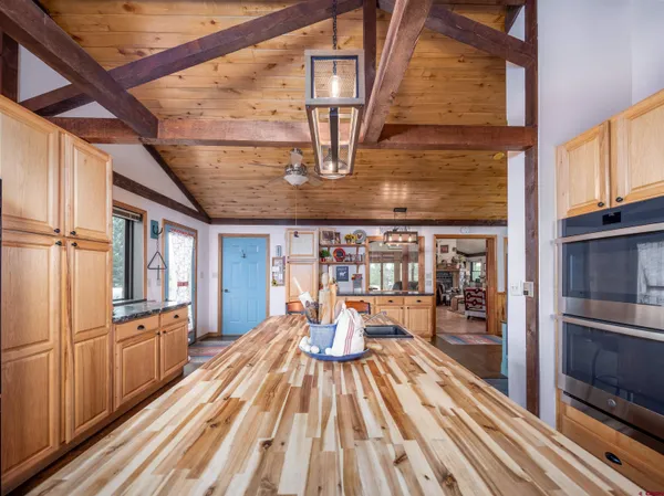 a kitchen with stainless steel appliances granite countertop a stove and a refrigerator