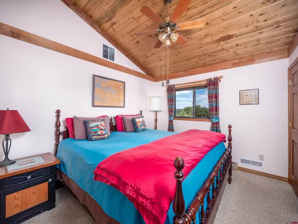 a bathroom with a toilet a sink and a mirror