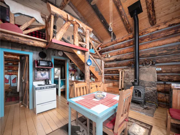 a bed sitting in front of a balcony