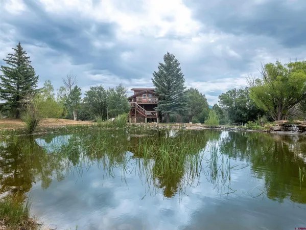 a bed room with furniture and a fireplace
