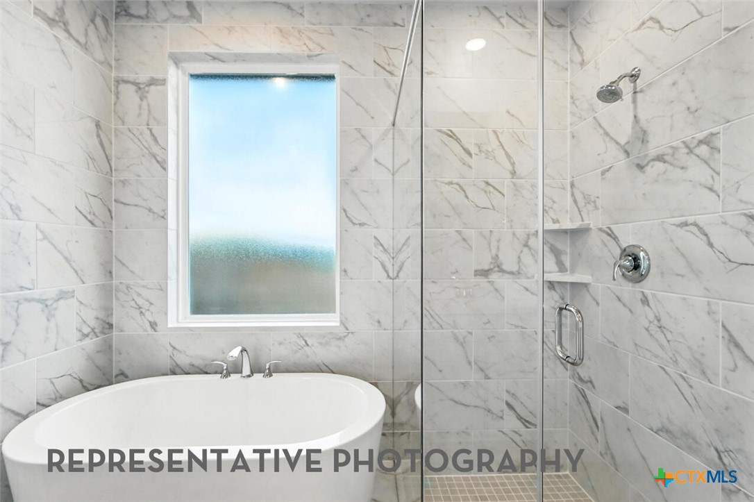 8905 Turaco Trail Austin, TX 78744 - Photo 13 of 27 a bathroom with a sink and a mirror