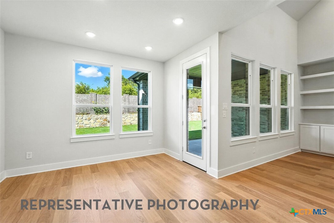 8905 Turaco Trail Austin, TX 78744 - Photo 16 of 27 an entryway with wooden floor