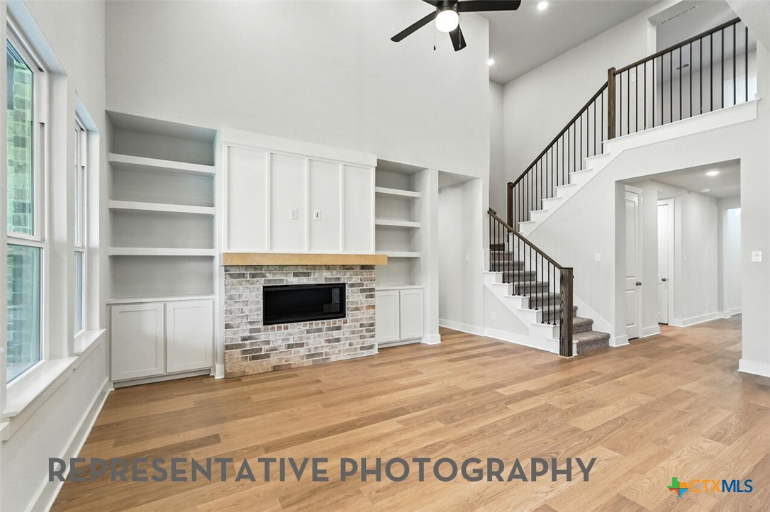 8905 Turaco Trail Austin, TX 78744 - Photo 8 of 27 a view of a livingroom with an empty space and a fireplace