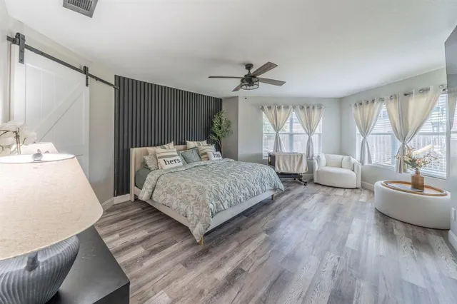 a kitchen with a sink a counter top space and stainless steel appliances
