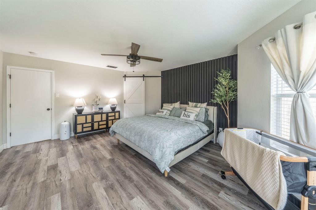 133 Adams Avenue Venus, TX 76084 - Photo 13 of 40 a spacious bedroom with a bed and a window