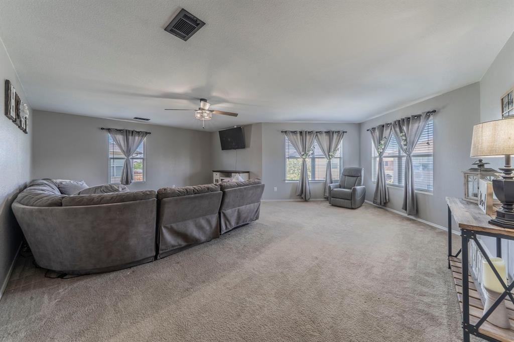 133 Adams Avenue Venus, TX 76084 - Photo 15 of 40 a living room with furniture and a flat screen tv