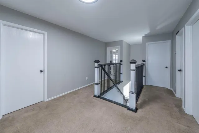 a living room with furniture and a ceiling fan