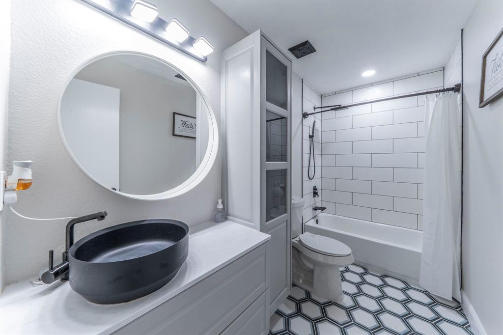 133 Adams Avenue Venus, TX 76084 - Photo 19 of 40 a bathroom with a sink a toilet and shower