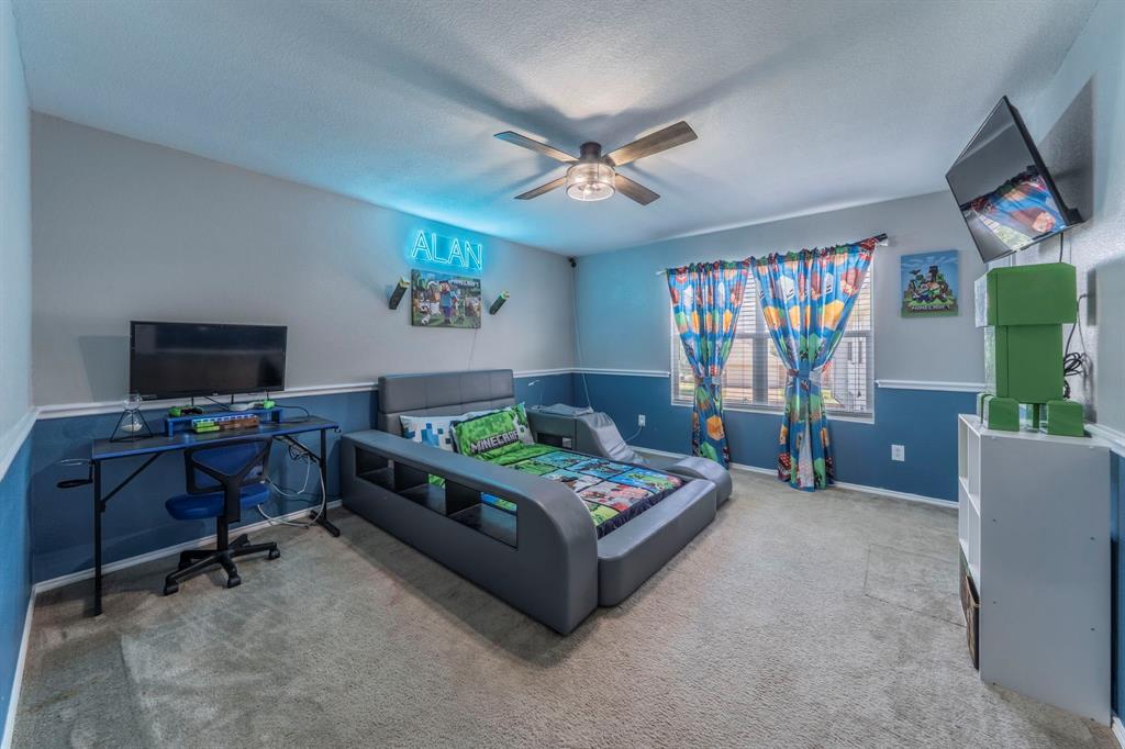 133 Adams Avenue Venus, TX 76084 - Photo 20 of 40 a living room with furniture and a flat screen tv