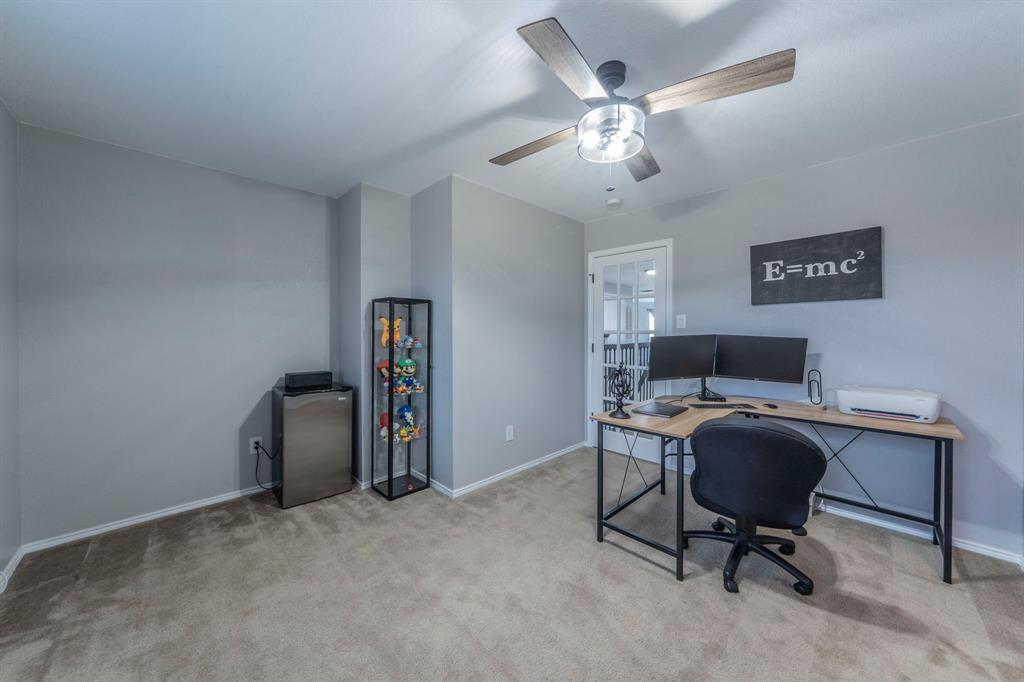133 Adams Avenue Venus, TX 76084 - Photo 26 of 40 a view of a workspace with furniture and a window