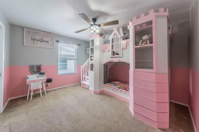 a view of a livingroom with furniture and windows