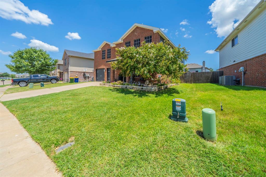 133 Adams Avenue Venus, TX 76084 - Photo 34 of 40 a front view of a house with a yard