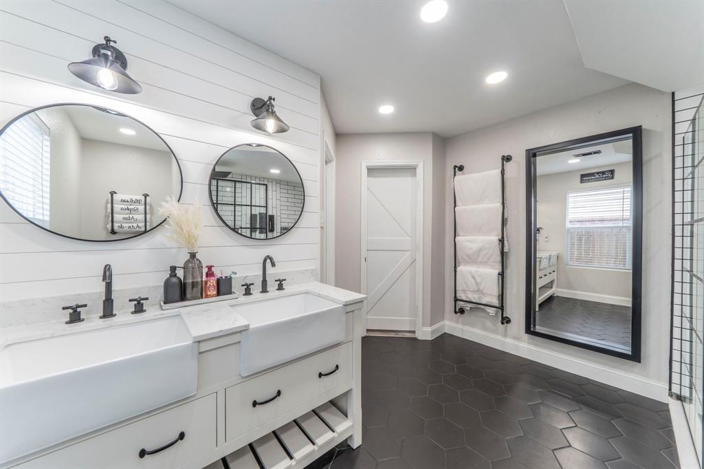 133 Adams Avenue Venus, TX 76084 - Photo 4 of 40 a bathroom with a double vanity sink and a mirror
