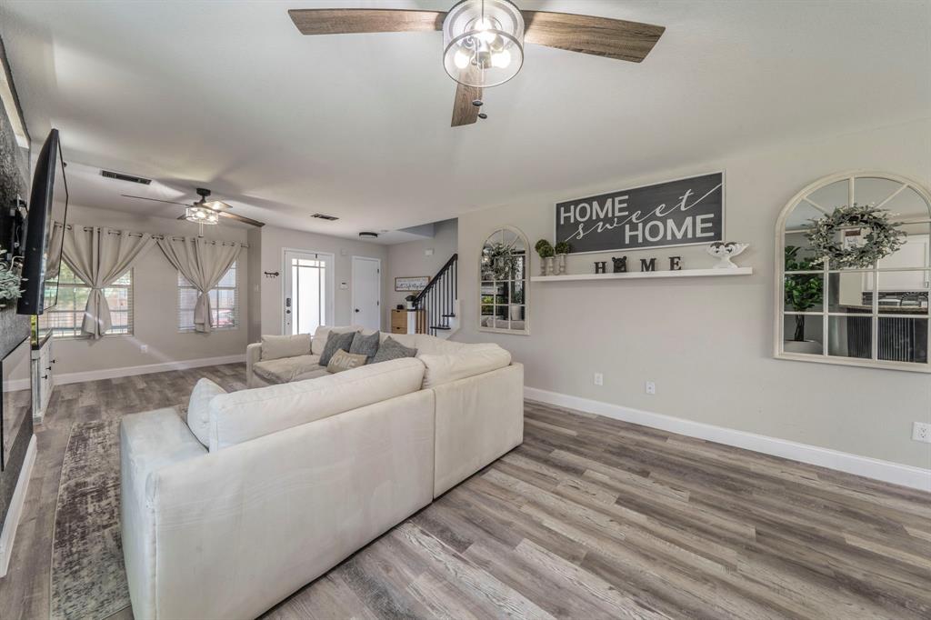 133 Adams Avenue Venus, TX 76084 - Photo 6 of 40 a living room with furniture and a chandelier