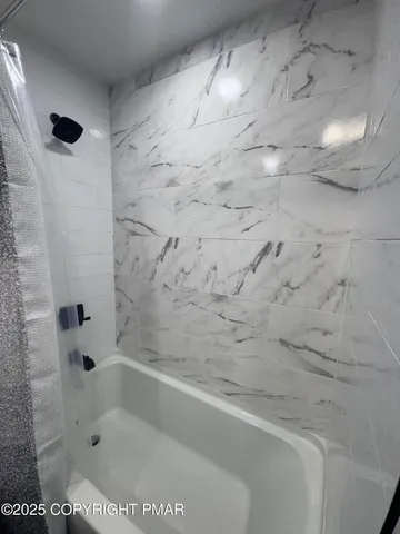 a view of deck with a flat screen tv