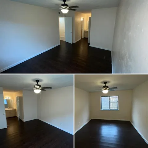 a view of an empty room with wooden floor and cabinet