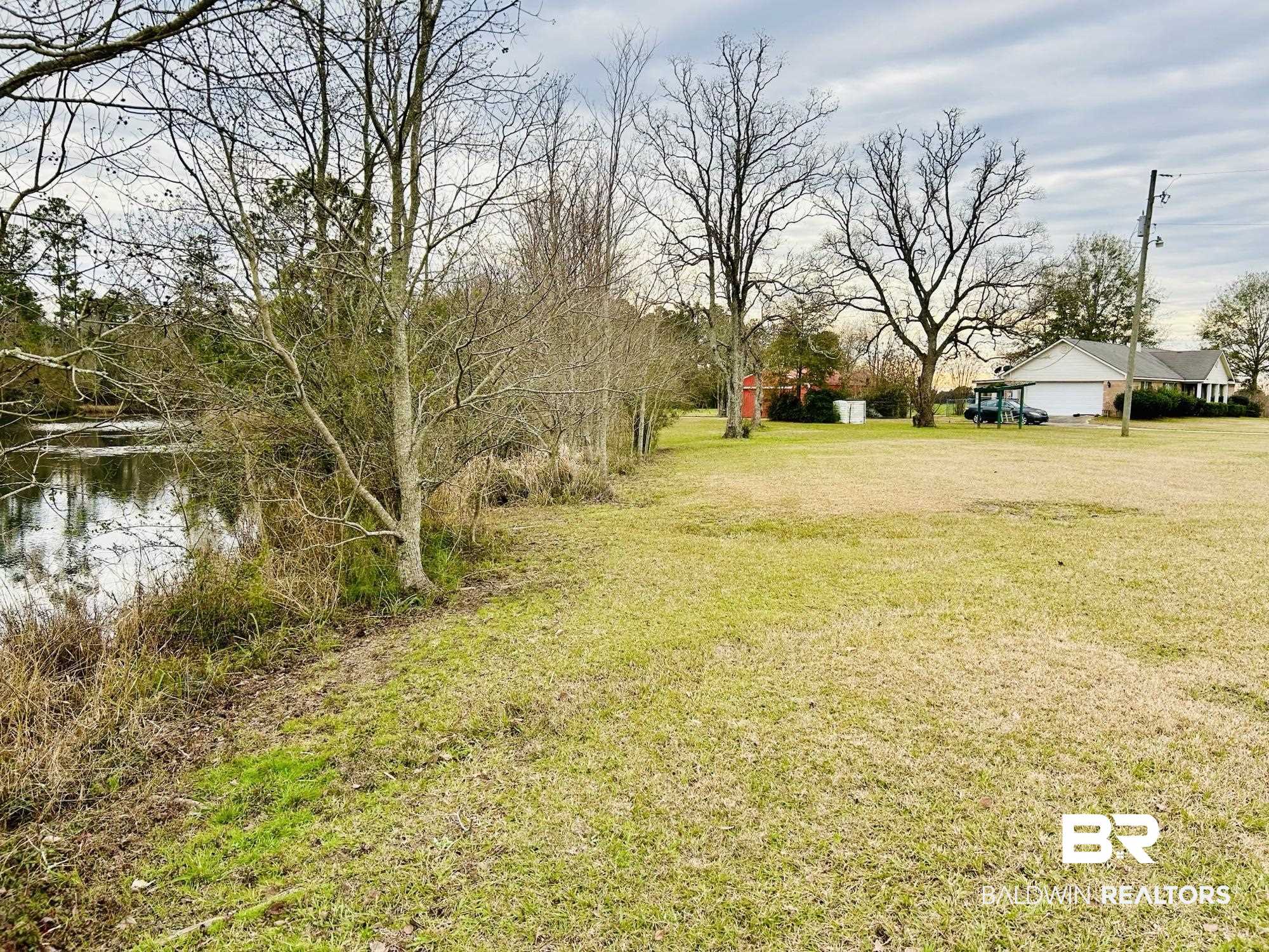13551 Gaston Loop Road Grand Bay, AL 36541 - Photo 13 of 15 View of yard with a water view