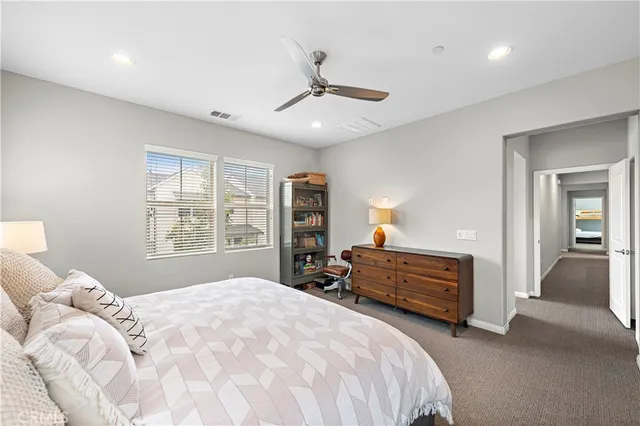 a bathroom with a large tub sink and mirror