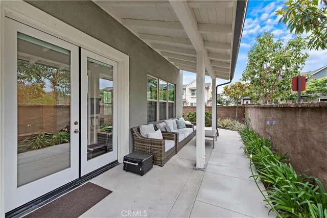 a view of a patio with chairs and a table