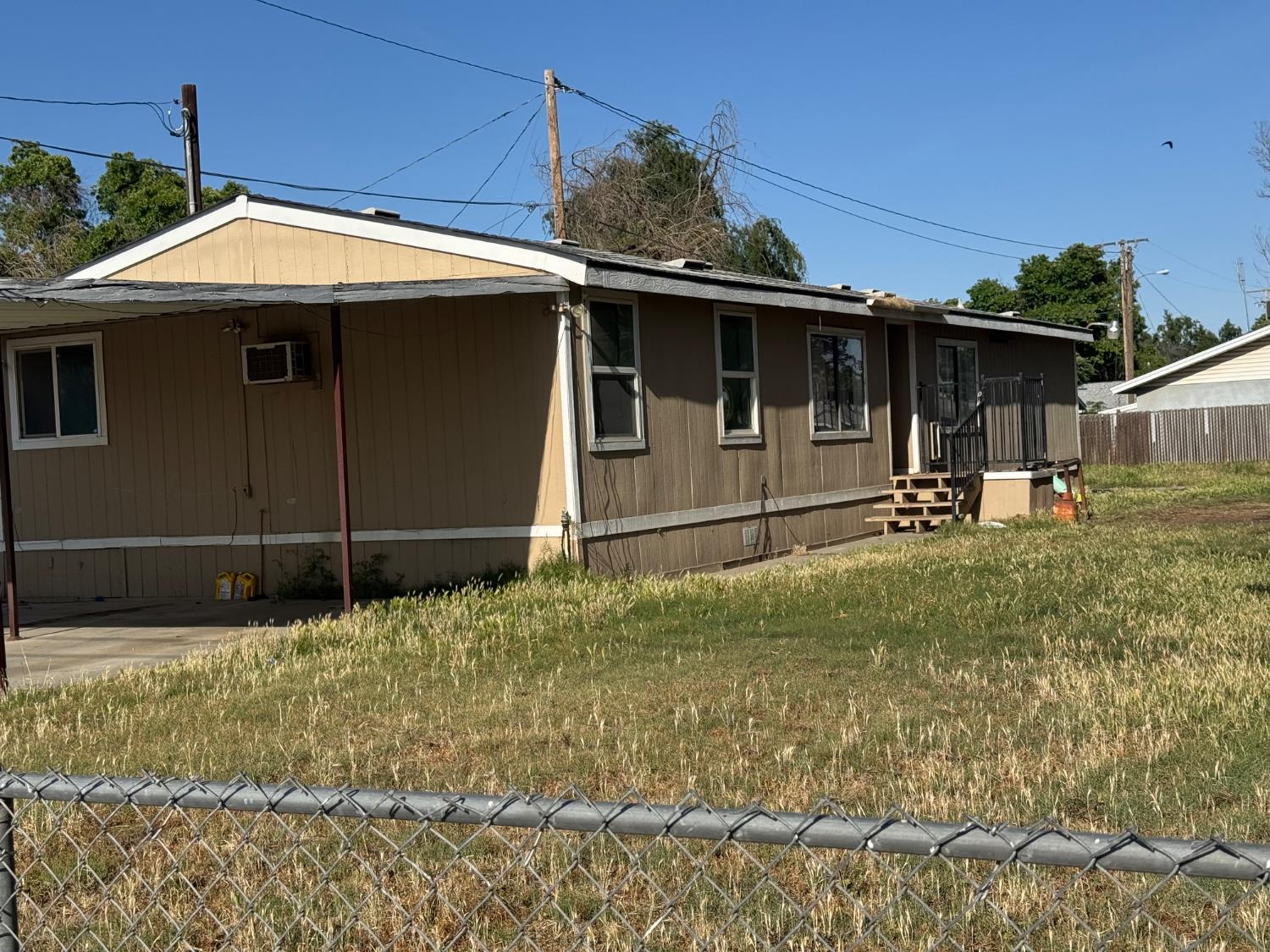 601 South Phillips Street Hanford, CA 93230 - Photo 1 of 18 a front view of a house with garden
