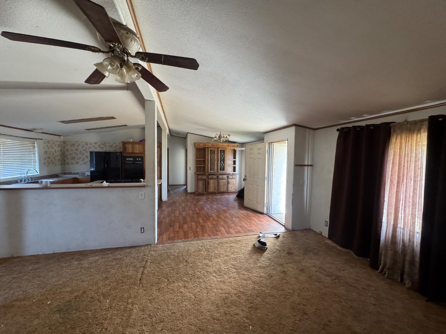 601 South Phillips Street Hanford, CA 93230 - Photo 11 of 18 a view of empty room with a fireplace