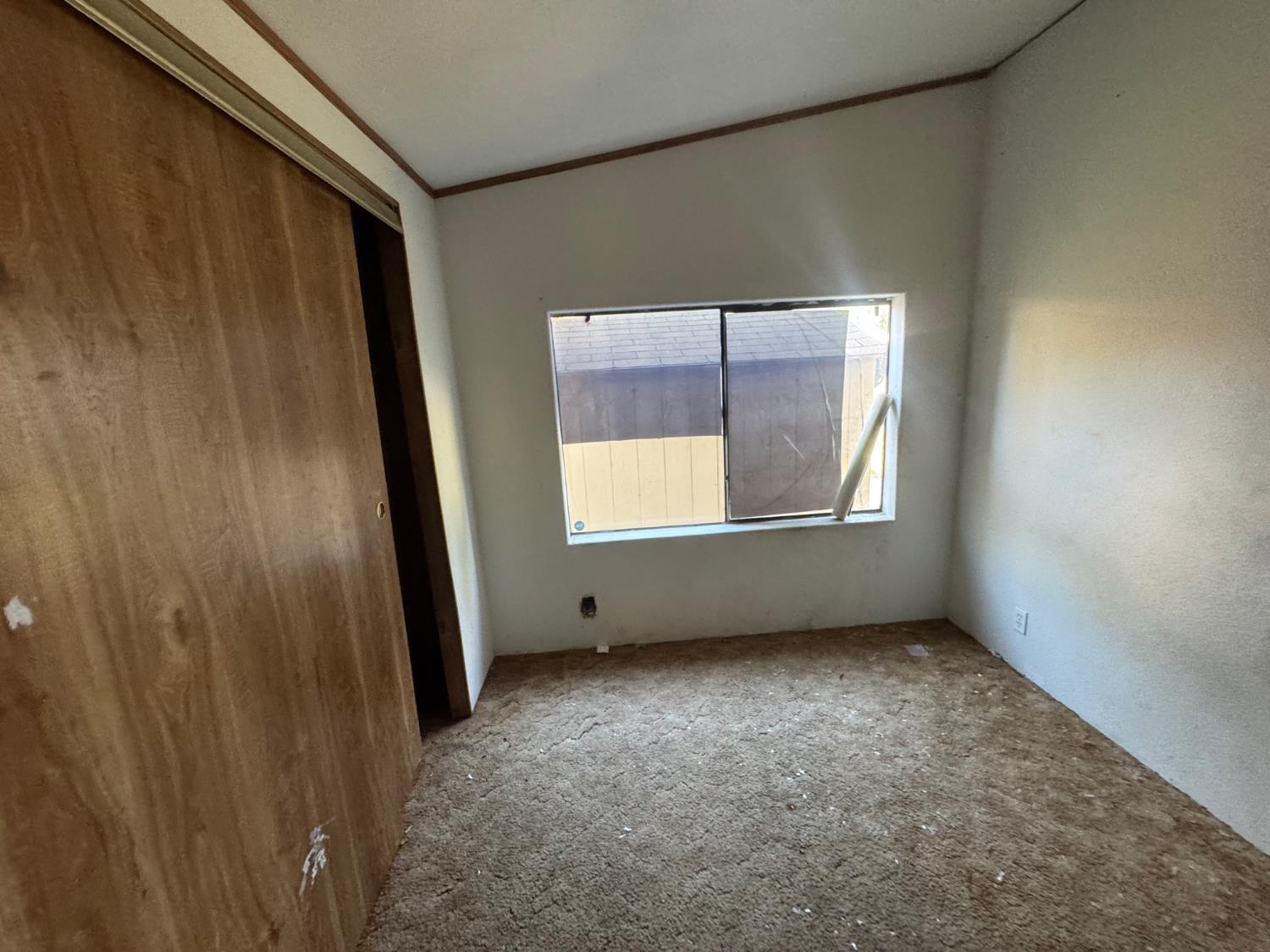 601 South Phillips Street Hanford, CA 93230 - Photo 18 of 18 an empty room with windows