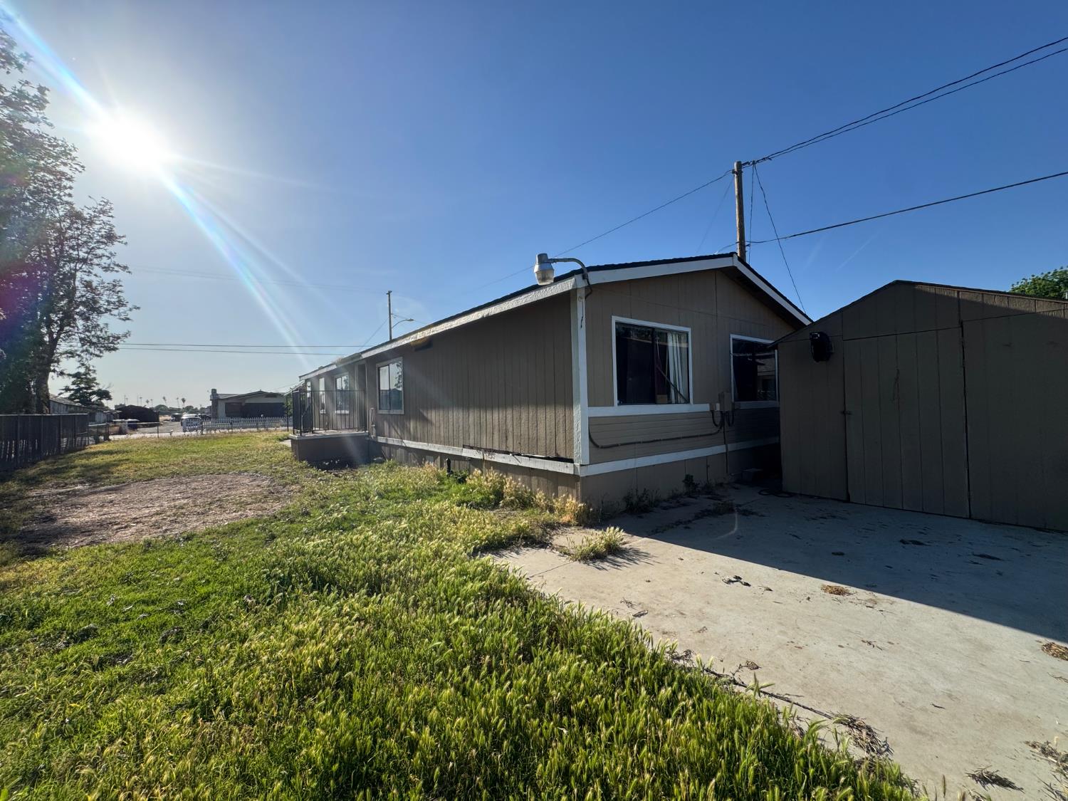 601 South Phillips Street Hanford, CA 93230 - Photo 2 of 18 a house view with a backyard space