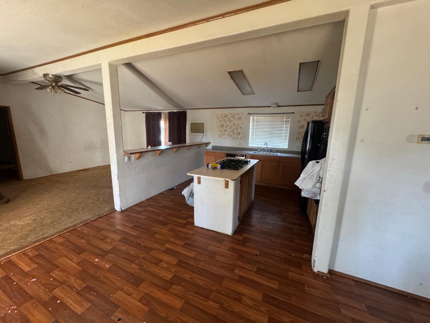 601 South Phillips Street Hanford, CA 93230 - Photo 7 of 18 a kitchen with a sink and a stove top oven
