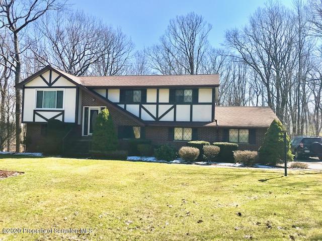 1420 Charles Road Lake Ariel, PA 18436 - Photo 1 of 47 a front view of a house with a yard