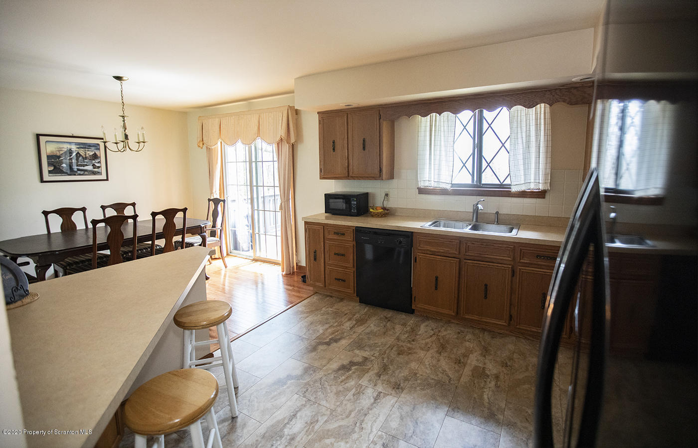 1420 Charles Road Lake Ariel, PA 18436 - Photo 14 of 47 a kitchen with sink a refrigerator and chairs
