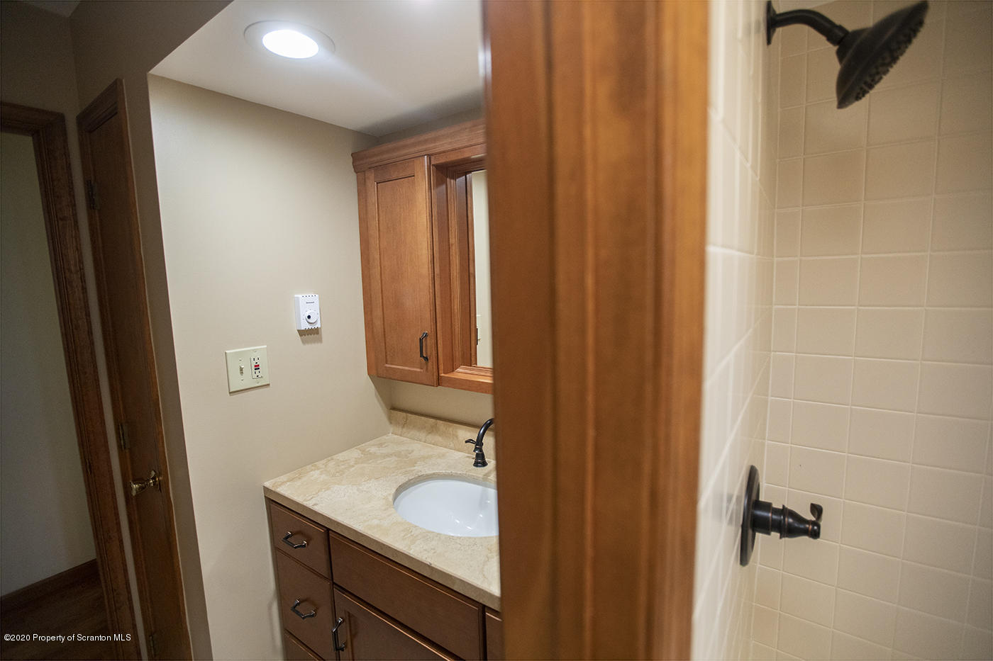 1420 Charles Road Lake Ariel, PA 18436 - Photo 20 of 47 a bathroom with a granite countertop sink and a mirror