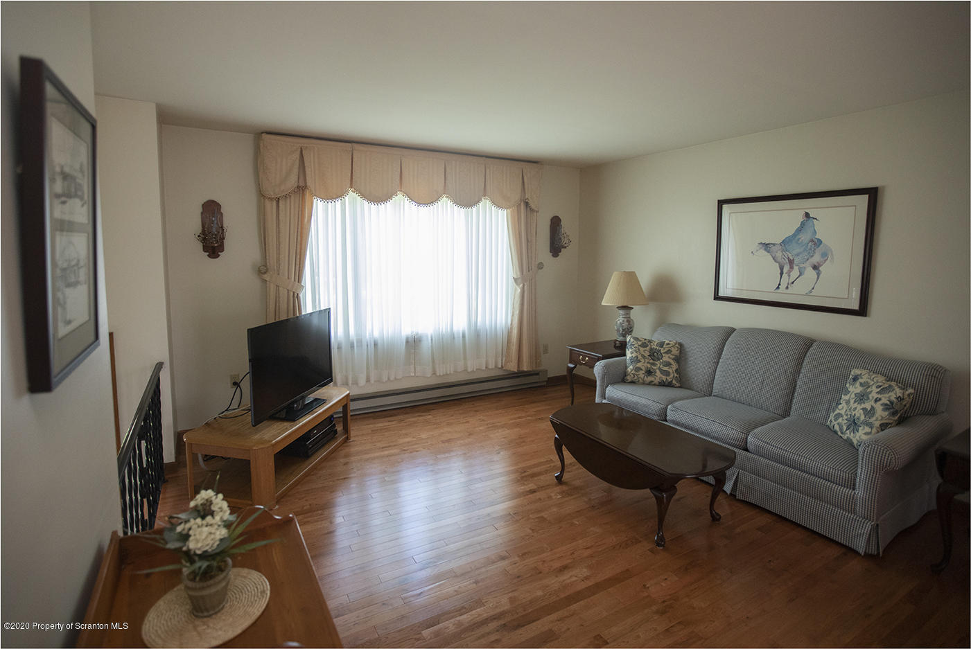 1420 Charles Road Lake Ariel, PA 18436 - Photo 9 of 47 a living room with furniture a flat screen tv and a window