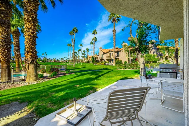 a view of a yard with patio