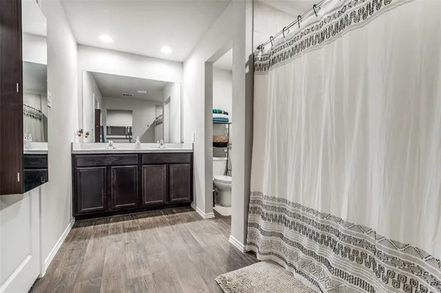 a view of a bathroom with a sink and mirror