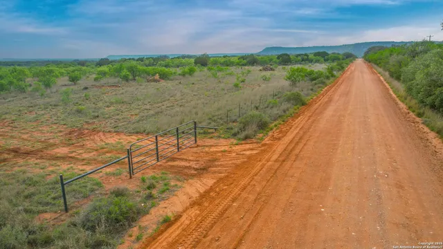 a view of a lake with a yard